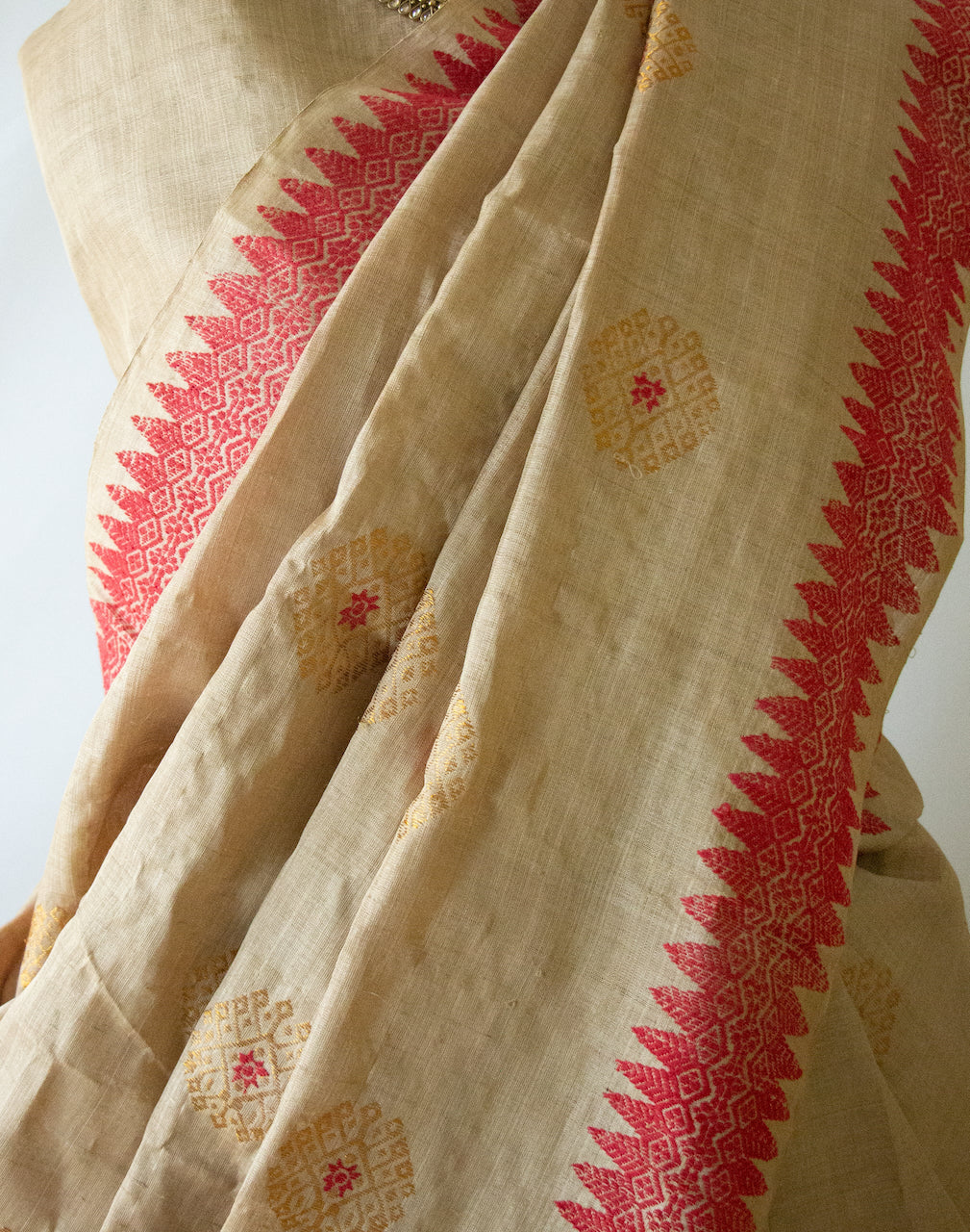 Muga Silk Sari with golden zari and Eri Silk motifs from Assam