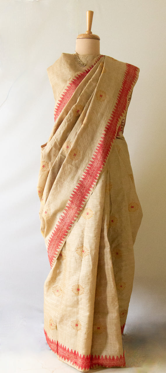 Muga Silk Sari with golden zari and Eri Silk motifs from Assam