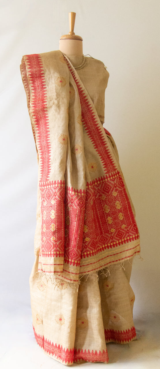 Muga Silk Sari with golden zari and Eri Silk motifs from Assam